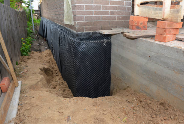 SJ Waterproofing Pros technician performing targeted Waterproofing assessment in Owens Cross Roads, AL